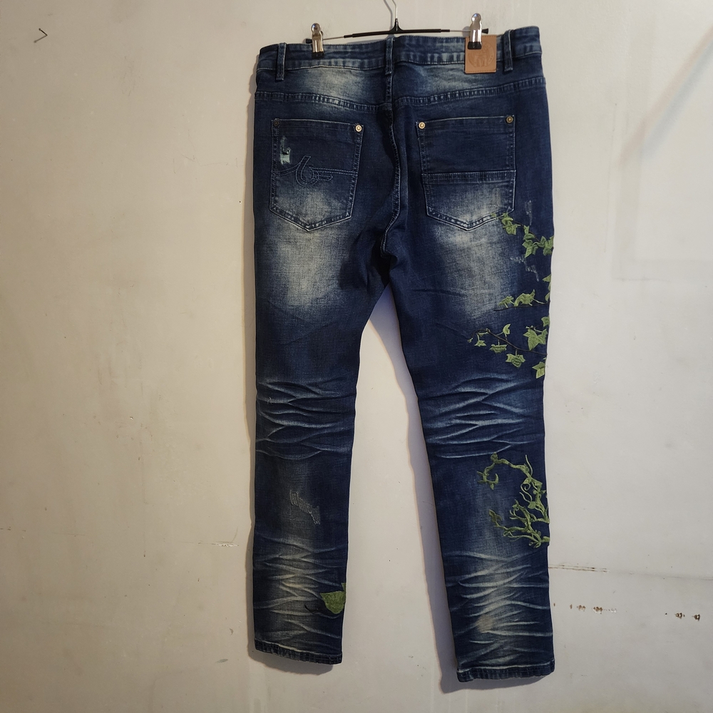 Stylish Blue Skinny Jeans with Green Leaf Accents